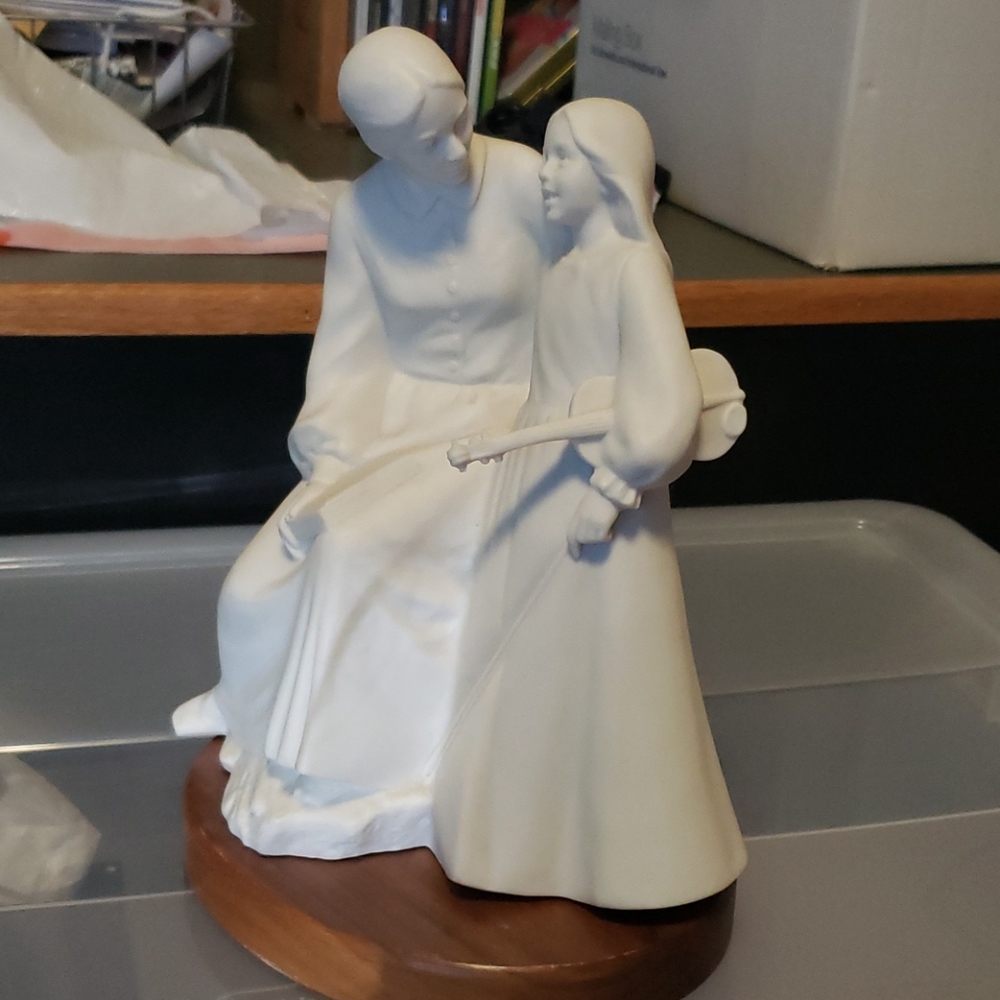 Mother and daughter statue